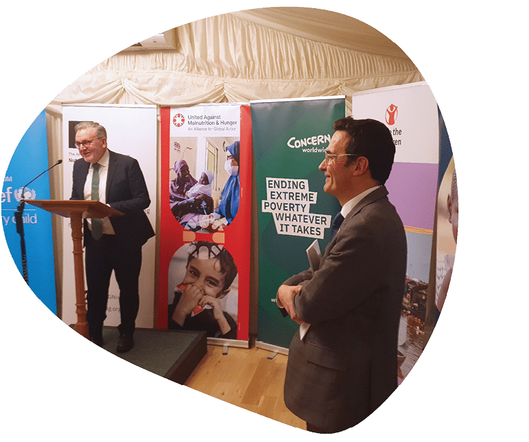 A teacher at a school in Mwanza, Tanzania, measures a child to ensure that he receives the correct dose of the medicine praziquantel during the mass drug administration campaign supported by Unlimit Health and the Tanzania Ministry of Health. This area of Tanzania is surrounded by lakes contaminated by schistosomes which put communities at risk of the disease.